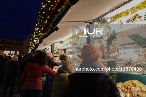 People are outside on the streets in Augsburg, Bavaria, Germany, on December 14, 2024, looking for gifts and presents. 