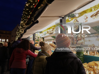 People are outside on the streets in Augsburg, Bavaria, Germany, on December 14, 2024, looking for gifts and presents. (