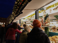 People are outside on the streets in Augsburg, Bavaria, Germany, on December 14, 2024, looking for gifts and presents. (