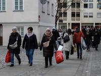 People are outside on the streets in Augsburg, Bavaria, Germany, on December 14, 2024, looking for gifts and presents. (