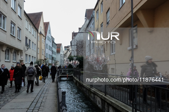 People are outside on the streets in Augsburg, Bavaria, Germany, on December 14, 2024, looking for gifts and presents. 