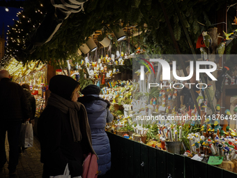 People are outside on the streets in Augsburg, Bavaria, Germany, on December 14, 2024, looking for gifts and presents. (