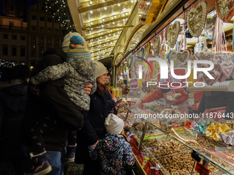 People are outside on the streets in Augsburg, Bavaria, Germany, on December 14, 2024, looking for gifts and presents. (