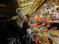 People are outside on the streets in Augsburg, Bavaria, Germany, on December 14, 2024, looking for gifts and presents. (