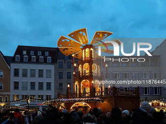 People are outside on the streets in Augsburg, Bavaria, Germany, on December 14, 2024, looking for gifts and presents. (