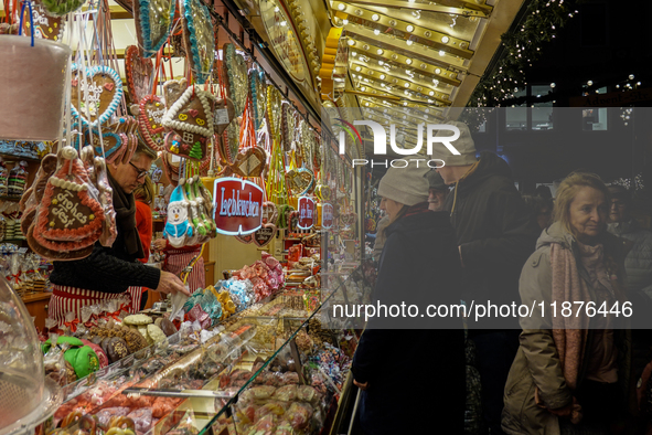 People are outside on the streets in Augsburg, Bavaria, Germany, on December 14, 2024, looking for gifts and presents. 