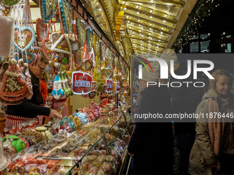 People are outside on the streets in Augsburg, Bavaria, Germany, on December 14, 2024, looking for gifts and presents. (