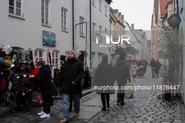 People are outside on the streets in Augsburg, Bavaria, Germany, on December 14, 2024, looking for gifts and presents. 