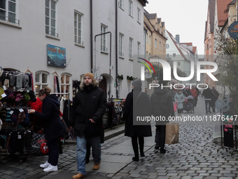 People are outside on the streets in Augsburg, Bavaria, Germany, on December 14, 2024, looking for gifts and presents. (