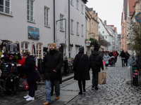 People are outside on the streets in Augsburg, Bavaria, Germany, on December 14, 2024, looking for gifts and presents. (