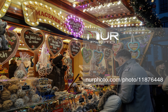 People are outside on the streets in Augsburg, Bavaria, Germany, on December 14, 2024, looking for gifts and presents. 