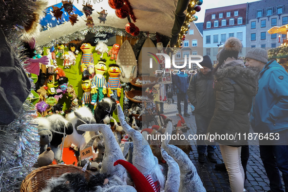 People are outside on the streets in Augsburg, Bavaria, Germany, on December 14, 2024, looking for gifts and presents. 