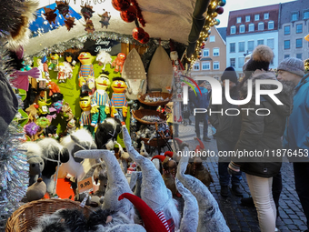 People are outside on the streets in Augsburg, Bavaria, Germany, on December 14, 2024, looking for gifts and presents. (