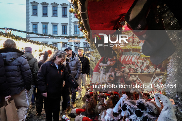 People are outside on the streets in Augsburg, Bavaria, Germany, on December 14, 2024, looking for gifts and presents. 