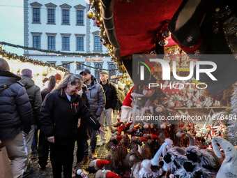 People are outside on the streets in Augsburg, Bavaria, Germany, on December 14, 2024, looking for gifts and presents. (