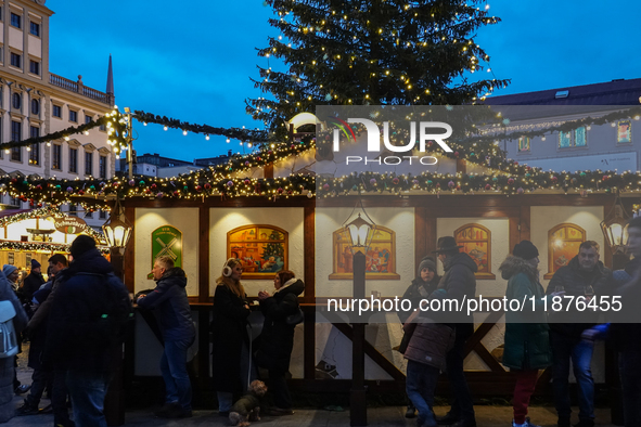 People are outside on the streets in Augsburg, Bavaria, Germany, on December 14, 2024, looking for gifts and presents. 