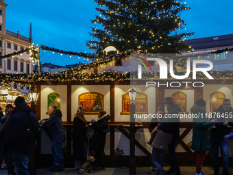 People are outside on the streets in Augsburg, Bavaria, Germany, on December 14, 2024, looking for gifts and presents. (