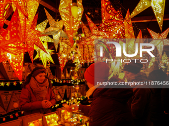 People are outside on the streets in Augsburg, Bavaria, Germany, on December 14, 2024, looking for gifts and presents. (