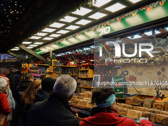 People are outside on the streets in Augsburg, Bavaria, Germany, on December 14, 2024, looking for gifts and presents. (