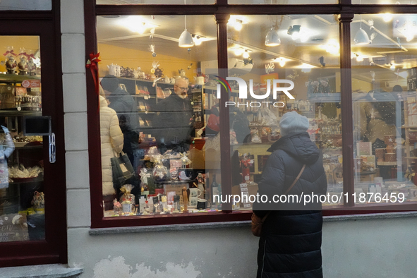 People are outside on the streets in Augsburg, Bavaria, Germany, on December 14, 2024, looking for gifts and presents. 