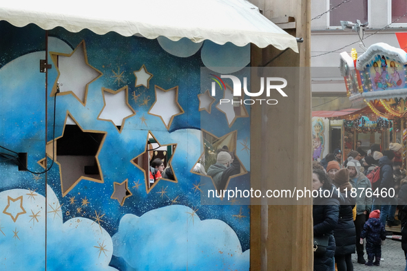 People are outside on the streets in Augsburg, Bavaria, Germany, on December 14, 2024, looking for gifts and presents. 