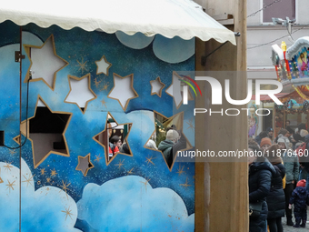 People are outside on the streets in Augsburg, Bavaria, Germany, on December 14, 2024, looking for gifts and presents. (