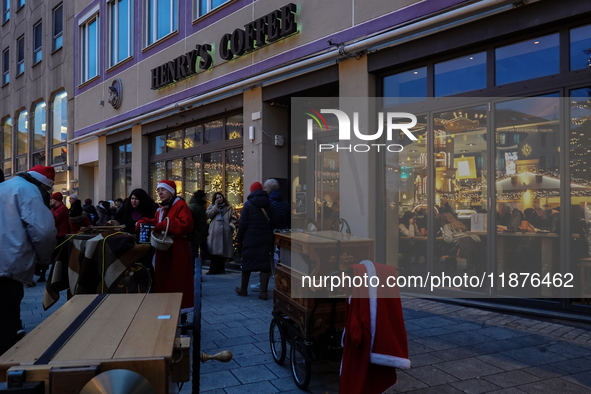 People are outside on the streets in Augsburg, Bavaria, Germany, on December 14, 2024, looking for gifts and presents. 