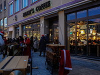 People are outside on the streets in Augsburg, Bavaria, Germany, on December 14, 2024, looking for gifts and presents. (