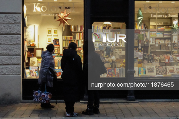 People are outside on the streets in Augsburg, Bavaria, Germany, on December 14, 2024, looking for gifts and presents. 