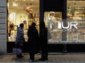 People are outside on the streets in Augsburg, Bavaria, Germany, on December 14, 2024, looking for gifts and presents. (