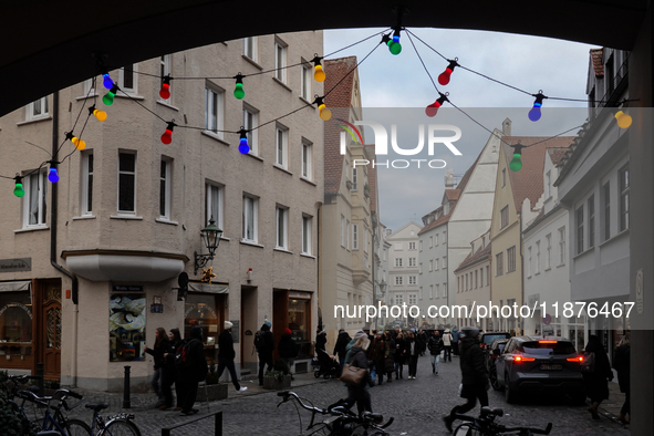 People are outside on the streets in Augsburg, Bavaria, Germany, on December 14, 2024, looking for gifts and presents. 