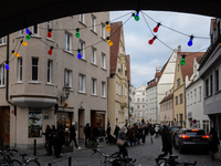 People are outside on the streets in Augsburg, Bavaria, Germany, on December 14, 2024, looking for gifts and presents. (