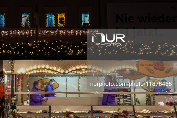 People are outside on the streets in Augsburg, Bavaria, Germany, on December 14, 2024, looking for gifts and presents. 