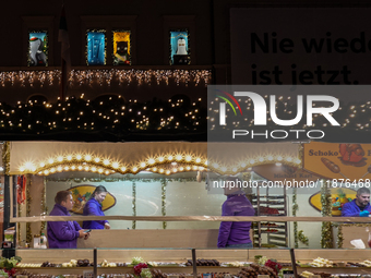 People are outside on the streets in Augsburg, Bavaria, Germany, on December 14, 2024, looking for gifts and presents. (