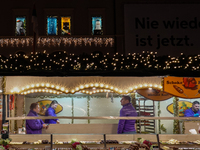 People are outside on the streets in Augsburg, Bavaria, Germany, on December 14, 2024, looking for gifts and presents. (