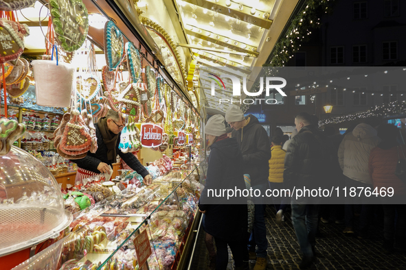 People are outside on the streets in Augsburg, Bavaria, Germany, on December 14, 2024, looking for gifts and presents. 