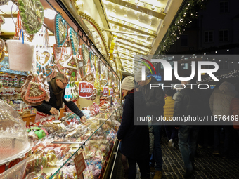 People are outside on the streets in Augsburg, Bavaria, Germany, on December 14, 2024, looking for gifts and presents. (