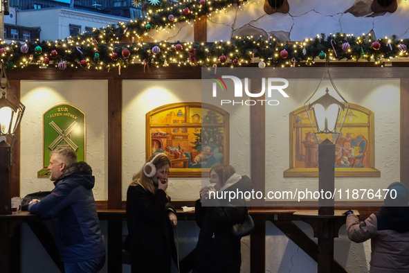 People are outside on the streets in Augsburg, Bavaria, Germany, on December 14, 2024, looking for gifts and presents. 