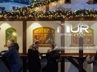 People are outside on the streets in Augsburg, Bavaria, Germany, on December 14, 2024, looking for gifts and presents. (