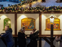 People are outside on the streets in Augsburg, Bavaria, Germany, on December 14, 2024, looking for gifts and presents. (