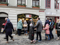 People are outside on the streets in Augsburg, Bavaria, Germany, on December 14, 2024, looking for gifts and presents. (