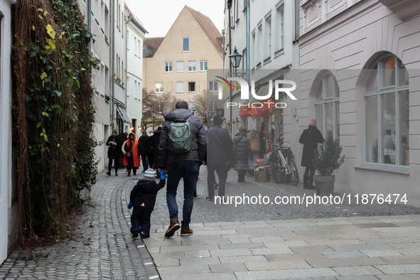 People are outside on the streets in Augsburg, Bavaria, Germany, on December 14, 2024, looking for gifts and presents. 