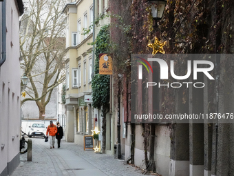 People are outside on the streets in Augsburg, Bavaria, Germany, on December 14, 2024, looking for gifts and presents. (