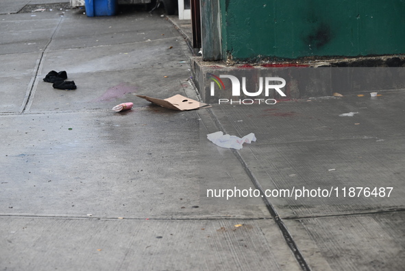 Objects from the victim are on the ground. A man is stabbed multiple times to death outside of Mucho Luco Deli Grocery in Brownsville, Brook...