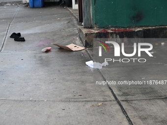 Objects from the victim are on the ground. A man is stabbed multiple times to death outside of Mucho Luco Deli Grocery in Brownsville, Brook...