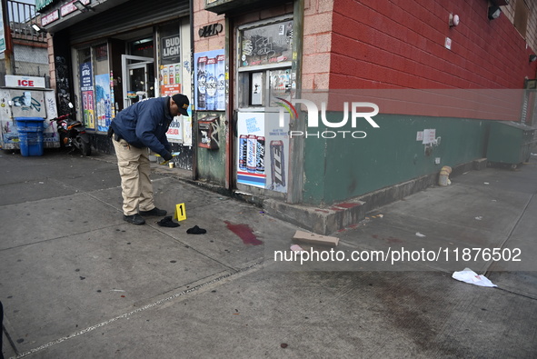 New York City Police Department crime scene investigators are at the scene of a 34-year-old man being stabbed multiple times to death at Muc...