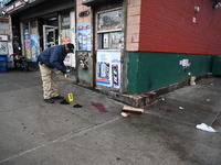 New York City Police Department crime scene investigators are at the scene of a 34-year-old man being stabbed multiple times to death at Muc...