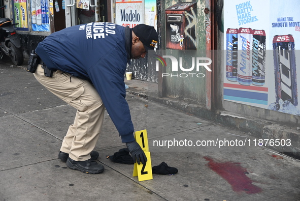 New York City Police Department crime scene investigators are at the scene of a 34-year-old man being stabbed multiple times to death at Muc...