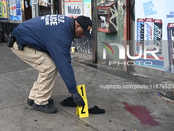 New York City Police Department crime scene investigators are at the scene of a 34-year-old man being stabbed multiple times to death at Muc...