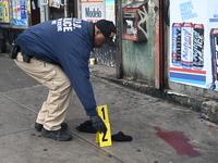 New York City Police Department crime scene investigators are at the scene of a 34-year-old man being stabbed multiple times to death at Muc...